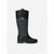 A single black and dark gray Michael Kors mid-calf boot with a signature monogram pattern and a silver heart-shaped MK logo on the front, shown against a plain light gray background.