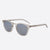 A pair of square sunglasses with a translucent light gray frame and muted blue-gray lenses, shown on a clean light gray background.