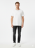 Man wearing a white t-shirt and black pants on a white background