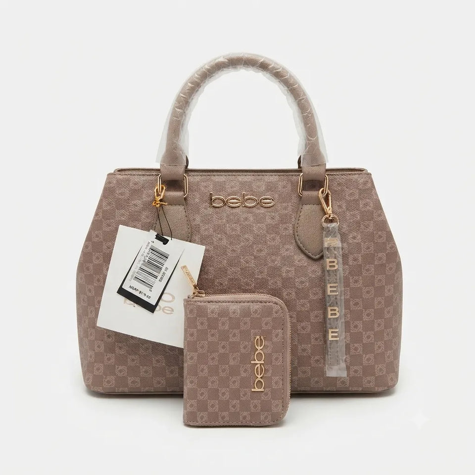 A beige and brown monogram handbag set by bebe, featuring a structured handbag with a matching zippered wallet in front, both with protective plastic wrapping on the handles and attached retail tags.
