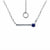 A silver bar necklace with a single deep blue gemstone pendant, displayed on a clean white background with an inset showing the adjustable ring clasp.