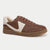 A brown leather low-top sneaker with a contrasting off-white side panel, matching brown laces, and a gum brown sole, shown against a plain light background.