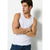 A man wearing a white sleeveless tank top and dark blue jeans, standing with arms crossed against a light gray background.