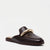 A dark brown leather mule loafer with a prominent curved gold-tone metal bar across the top, shown from a three-quarters angle on a light gray background.