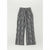 Black and white vertically striped wide-leg pants with an elastic waistband, displayed flat against a light gray background.