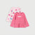 Two girls' long-sleeve tops in pink tones on a light gray background. The front top is solid medium pink with the word 'love' in white across the chest and a ruffled hem.