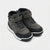 A pair of high-top sneakers in dark gray suede and black synthetic materials, featuring black laces with silver studs, a black toe cap, and a white midsole, shown on a light gray background.