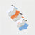 Six pairs of low-cut ankle socks arranged diagonally on a light gray background, labeled Monday through Sunday in black text.