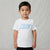 A young boy wearing a white Nike crewneck t-shirt with a light blue gradient logo on the chest and a small blue swoosh on the sleeve, standing against a light gray textured backdrop.