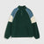 A color-blocked quarter-zip pullover sweatshirt in dark green, light blue, and cream, displayed flat against a light gray background.