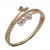 A gold-plated bangle bracelet featuring a butterfly and flower motif with iridescent white inlay, accented by clear rhinestones, shown on a white background.