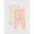 Two pairs of children's leggings laid flat on a light gray background. One pair is pale yellow with a small purple and green floral print, and the other is light pink with a dense multicolor floral print including pink, purple, yellow, and orange flowers.