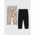 Two pairs of children's jogger pants laid flat on a light gray background: one pair is beige with a black and brown leopard print, and the other pair is solid black.