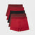 A set of five men's boxer briefs in various shades of red, burgundy, and black, arranged in a neat diagonal stack on a light gray background.