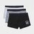 Three pairs of men's boxer briefs stacked diagonally on a light gray background. The front pair is black with a white graphic print reading 'GOOD FRIENDS SEND WOODS' and an illustration of a coffee cup.