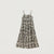 A sleeveless midi dress with thin spaghetti straps and an all-over floral toile pattern in beige and black, shown flat against a light gray background.