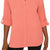 A coral pink button-down shirt with three-quarter sleeves rolled up to show tie details on the cuffs, worn by a model.