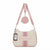 A light pink and beige shoulder bag with a matching round coin pouch and shoulder strap, featuring the brand name 'bebe' in pink on the front, set against a plain white background.