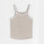 A light beige ribbed tank top with white contrast trim along the double shoulder straps and neckline, displayed flat against a clean white background.