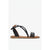 White sandal with a block heel on a light beige background