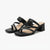 A pair of black leather strappy mule sandals with a low block heel and square toe, shown on a clean white background.