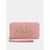 A pink zip-around wallet with a wristlet strap, featuring a metallic gold cursive 'Bebe' logo on the front, set against a light gray background.