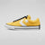 A yellow Converse All Star low-top sneaker with a white star logo, white rubber sole, and black laces, shown in a side profile on a light gray background.