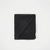 A folded black scarf with a subtle woven texture and fringed edges, displayed on a clean white background.