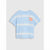 A light blue and white tie-dye short-sleeve t-shirt featuring a small orange shrimp graphic on the left chest, displayed against a neutral light gray background.