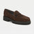 A brown leopard-print slip-on shoe with a chunky black platform sole and a small black chain detail across the vamp, shown on a light gray background.
