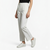 Person wearing a black t-shirt, white pants, and white sneakers on a white background