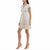 A woman modeling a short white wrap-style dress with a beige floral pattern, cap sleeves, and a V-neckline, paired with beige high-heeled sandals against a plain white background.