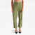 A model is shown from the waist down wearing olive green cropped trousers with front patch pockets and black pointed-toe heels, set against a plain white studio background.