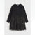 A black long-sleeve dress with a solid black top and a tiered tulle skirt covered in small silver sequins, shown against a light gray background.
