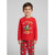 A young boy wearing a red long-sleeve pajama top with a Mickey Mouse Christmas graphic and the text 'Did Someone Snip Party?!!' and matching red pajama pants with a Christmas tree and character print, photographed against a light gray studio background.