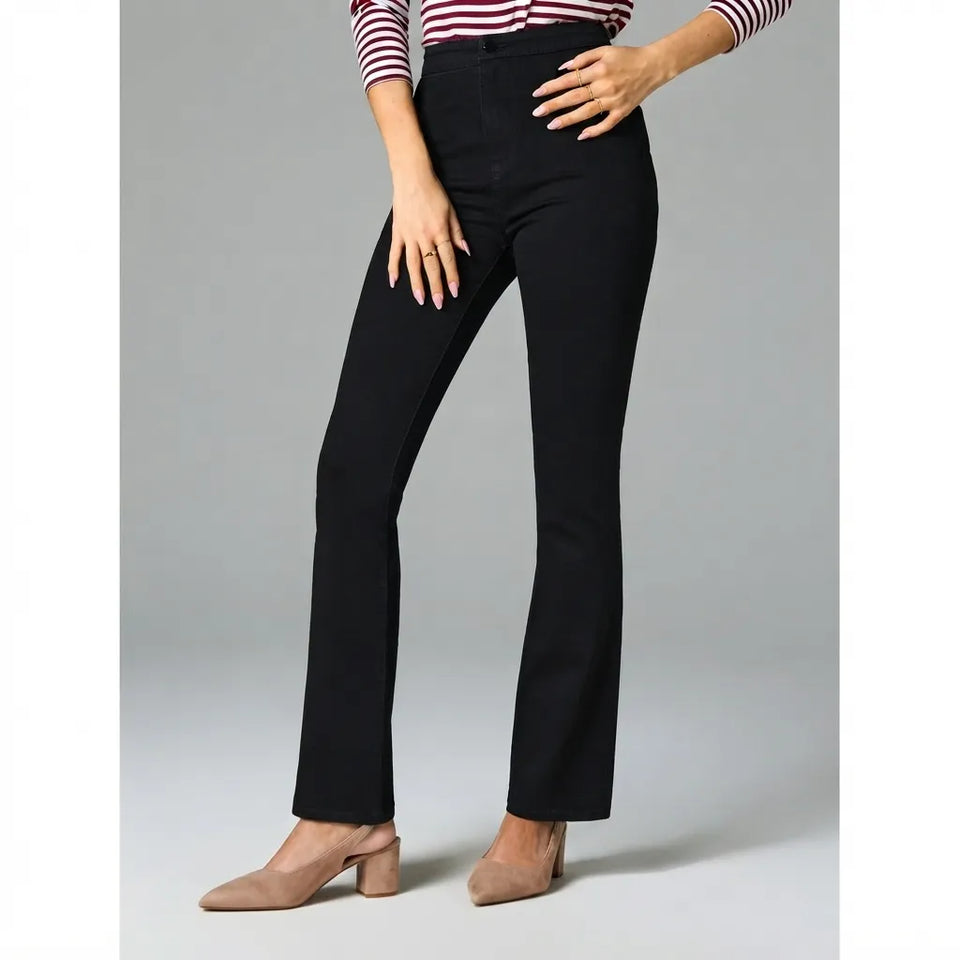 A model wearing black high-waisted straight-leg jeans, styled with a red and white striped long-sleeve top and beige slingback heels, against a neutral gray studio background.