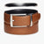 A brown leather belt with a silver-tone metal buckle, neatly coiled on a light gray background. A faint black oval shape is visible in the upper background.
