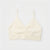 An off-white/cream bralette with thin spaghetti straps and a gathered ruched center front, displayed flat against a clean white background.