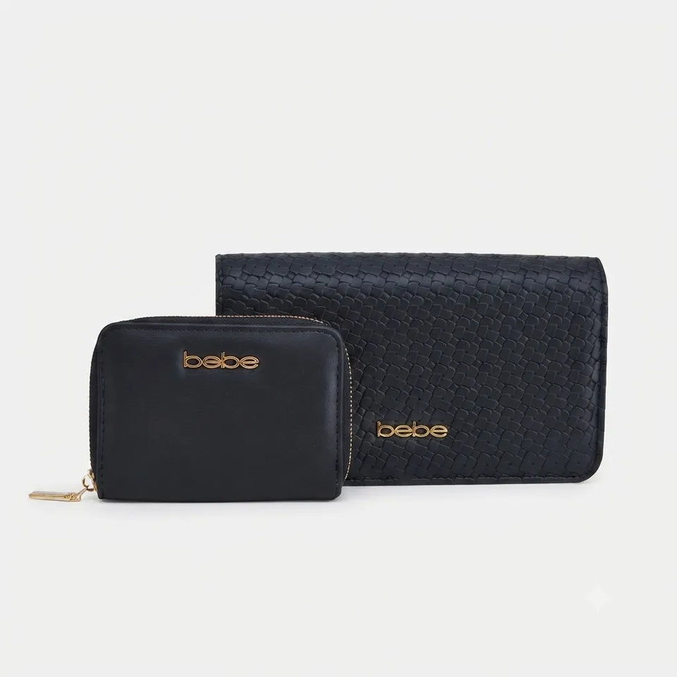 A black leather and woven-texture wallet set by Bebe, featuring a smaller zippered wallet in front of a larger matching zip-around wallet, both with gold-tone 'bebe' branding on a light gray background.