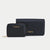 A black leather and woven-texture wallet set by Bebe, featuring a smaller zippered wallet in front of a larger matching zip-around wallet, both with gold-tone 'bebe' branding on a light gray background.