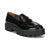 A black patent leather penny loafer with a chunky lug sole, shown from a three-quarters angle on a white background.