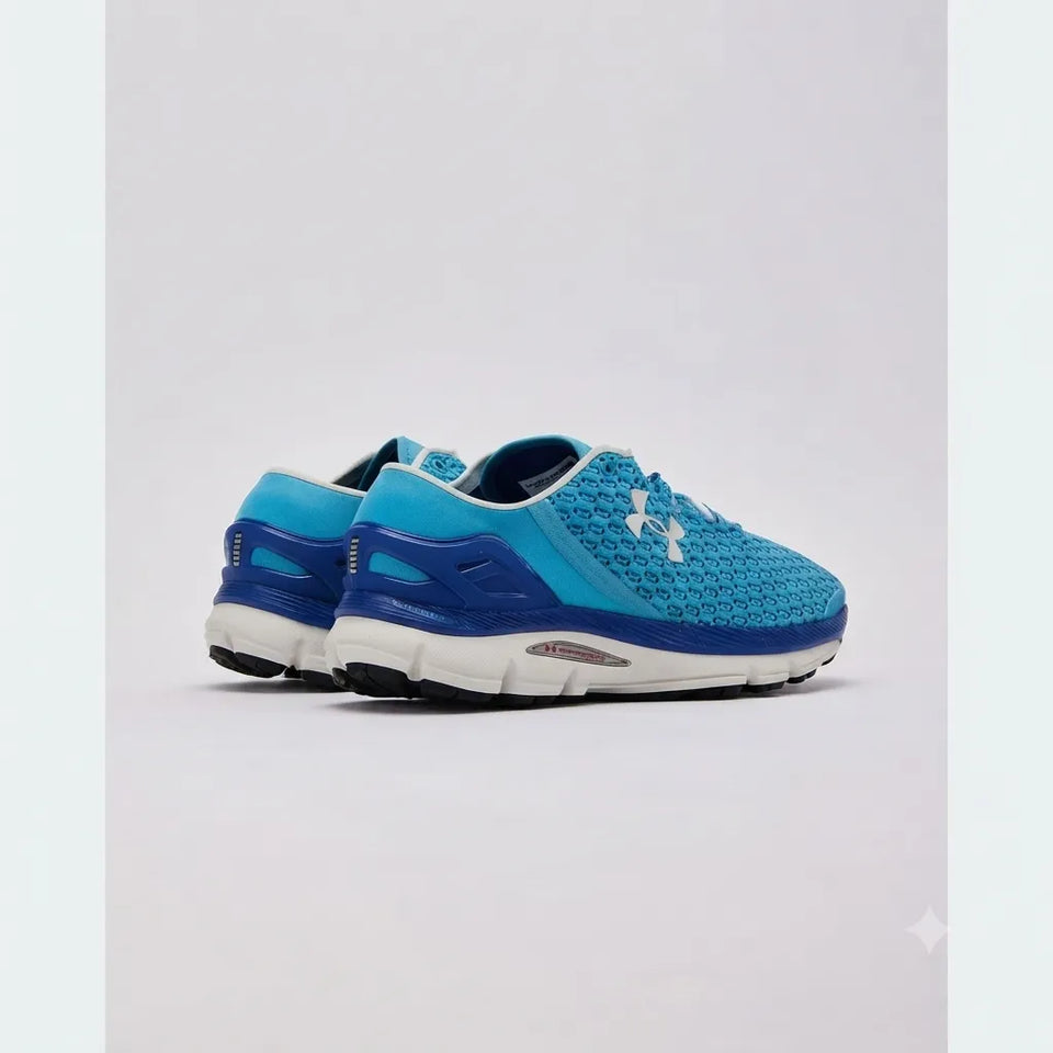 A pair of Under Armour running shoes in blue and teal with a white logo, shown from a side profile view on a light gray background.