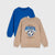 Two kids' crewneck sweatshirts shown on a light gray background: a tan sweatshirt in front with a blue and black soccer graphic and the words 'FOOTBALL WINNER' and 'THE NEXT TEAM IN USA', and a royal blue sweatshirt behind it with a small soccer graphic near the chest.