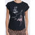A woman wearing a black short-sleeve t-shirt with a white line-art graphic of a woman's face and pink paint splatters, paired with leopard print pants.