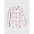 A white long-sleeve button-up shirt with a small all-over floral and butterfly print, shown flat against a light gray background.