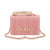 A pink pleated leather handbag with a gold-tone top handle and a matching pink and gold chain strap. The brand name 'bebe' is displayed in gold-tone letters on the front, embellished with small rhinestones.
