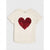 An off-white short-sleeve t-shirt featuring a large, reversible sequin heart graphic on the front in red and black, displayed against a light gray background.