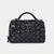 A black woven leather handbag with gold-tone hardware, featuring dual top handles, a detachable shoulder strap, and a small gold 'bebe' logo on the front, set against a light gray background.