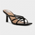 A single black leather high-heeled sandal with a square toe, thin wrap-around straps, and a low block heel, shown on a light gray background.