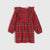 A red plaid long-sleeve dress for toddlers, featuring ruffled shoulder details and a gathered waist, shown against a light gray background.